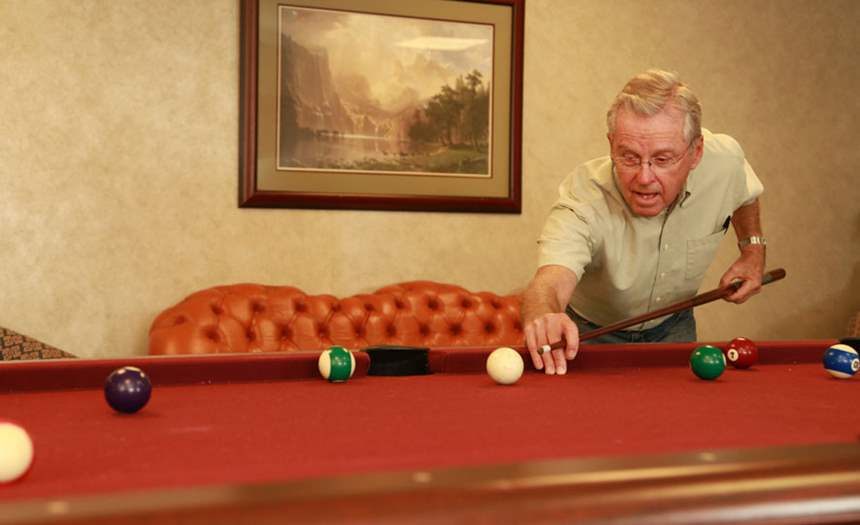 Resident playing pool