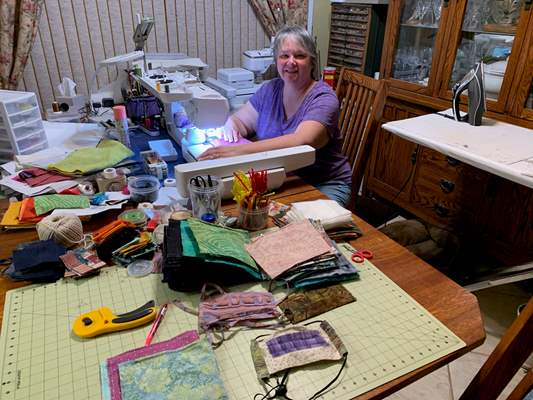 woman sewing face masks