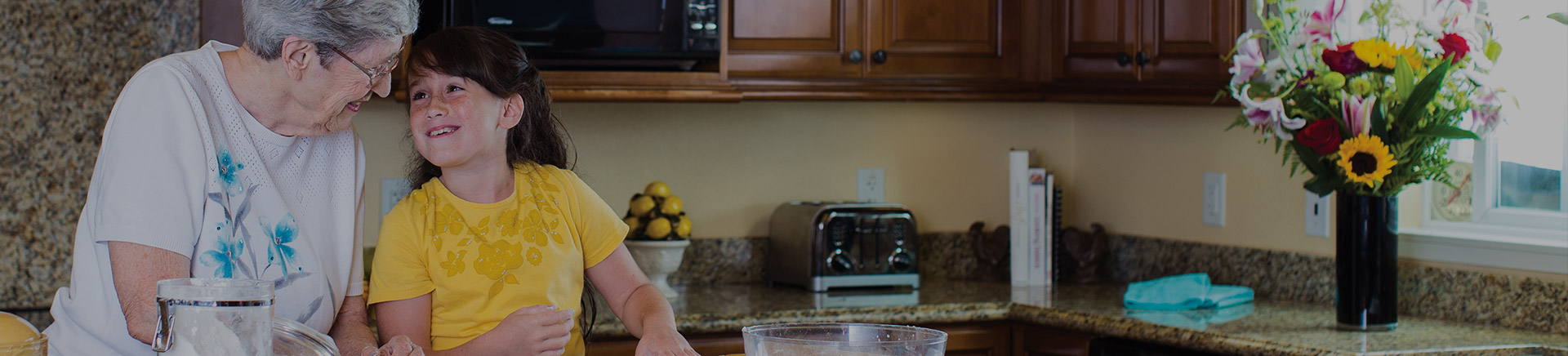 Elderly woman cooking with child