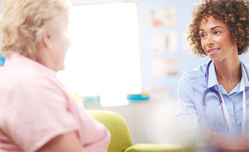 Resident talking to doctor